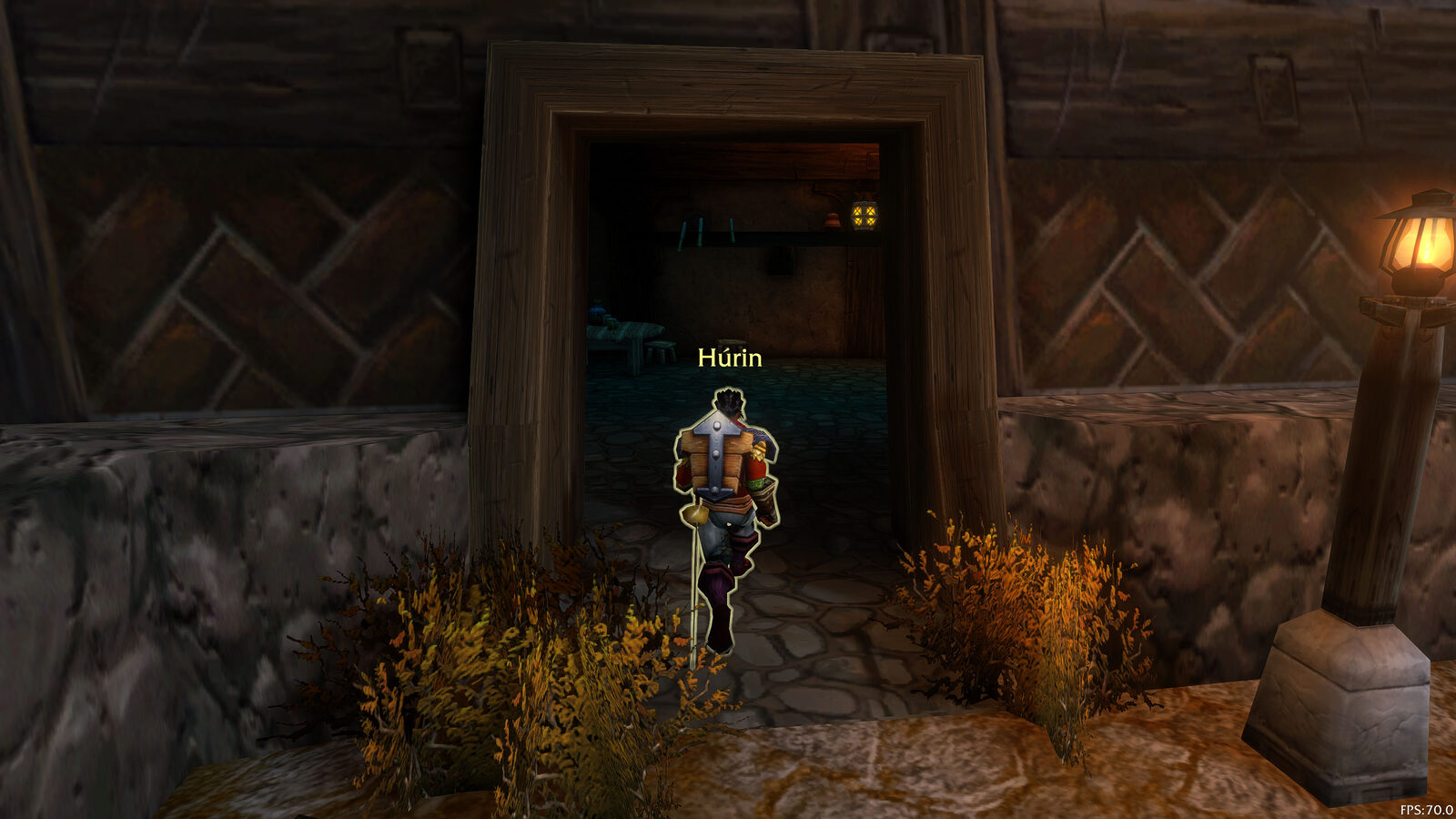 Heading out for the first quests. A new character walking through a wooden doorway at dusk